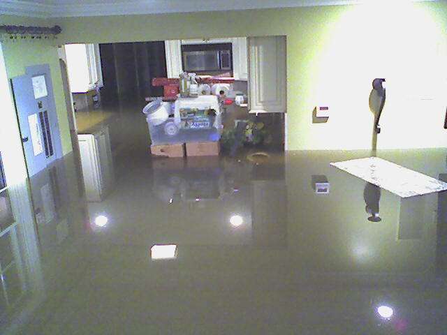 Flooded room with water across the floor