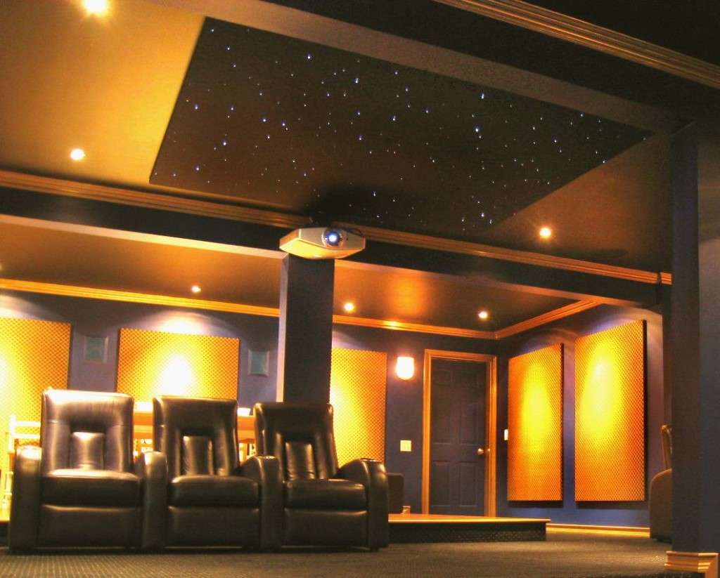 Home theater with 3 recliners, warm wall lights, and a star ceiling