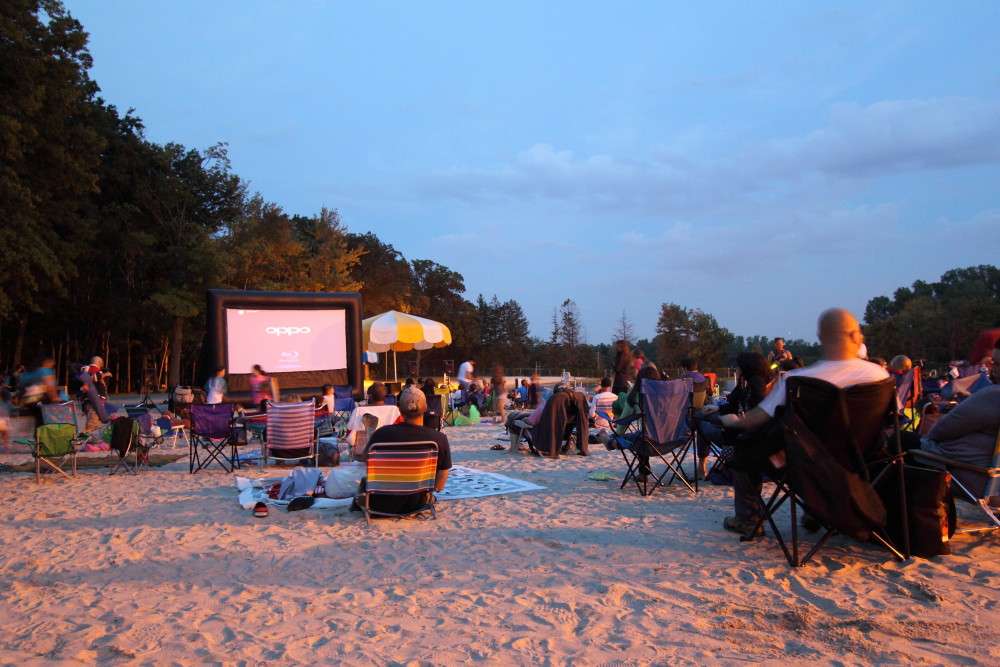 Families enjoying Movie Night at PV Park Beach hosted by One Sound Choice