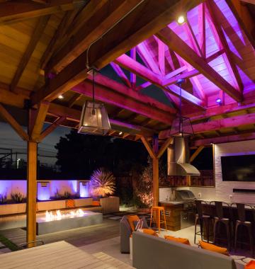 Outdoor arbor and patio with integrated lighting, audio, and control