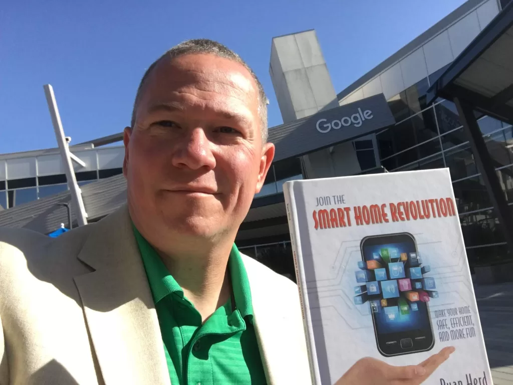 Ryan Herd holding his book Join the Smart Home Revolution